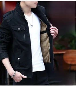 Detail of men's casual black jacket showing warm khaki fleece lining and ribbed cuffs