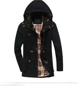 Detail showing the red brown checkered lining and metal zipper of the black cargo jacket