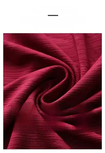 Detail shot of breathable dark red ice silk fabric with vertical knitted texture and soft feel