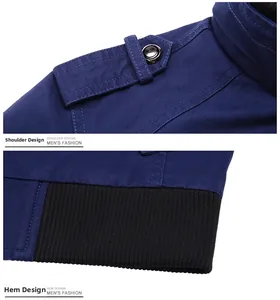 Detail view of dark blue men's jacket showing epaulet design and black ribbed hem