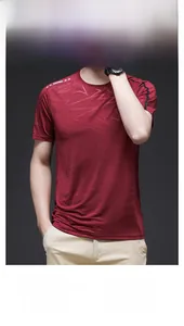 Detail of burgundy mesh T-shirt showing breathable fabric texture and geometric pattern