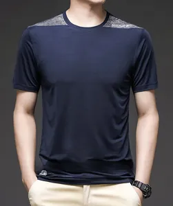Detail view of quick-dry fabric texture and grey patchwork on men's blue sport t-shirt
