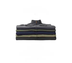 Stack display of lightweight outdoor vests in five colors with textured cargo fabric