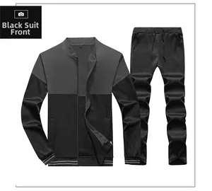 Detailed flat lay of men's black tracksuit with stand-up collar and ribbed stripe cuffs