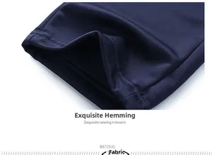 Detail shot of navy blue pants featuring high-quality double-needle hem and textured fabric