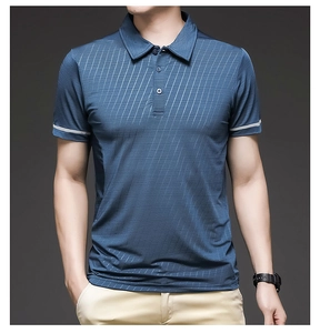 Detail of navy blue polo shirt with textured ice silk fabric and white striped cuffs