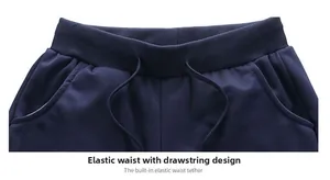 Detail view of navy sports pants with elastic ribbed waistband and internal drawstring