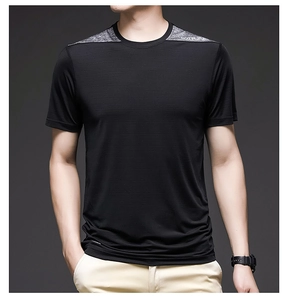 Detail of men's quick-dry sports t-shirt showing breathable fabric and grey shoulder panel