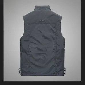Detail view of dark grey outdoor vest back with Freedom to Roam embroidery and drawstring