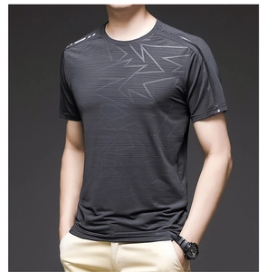 Detail of grey short sleeve sports T-shirt showing breathable fabric texture and geometric pattern