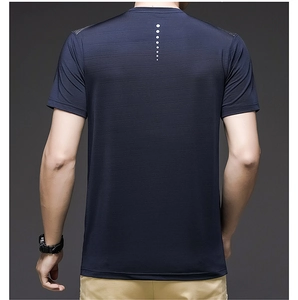 Detail of navy blue quick-dry T-shirt fabric with white dots and breathable texture