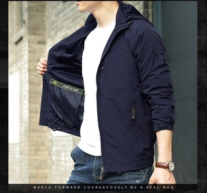 Detail of navy blue outdoor jacket featuring mesh lining and internal zipper pocket