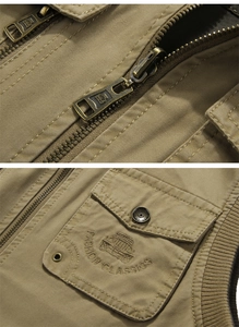Detailed embroidery of classic jeep logo and durable metal zipper on khaki utility vest