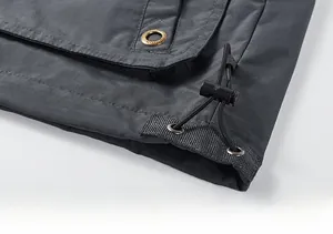 Macro view of adjustable hem with elastic drawstring and fashion eyelet detail