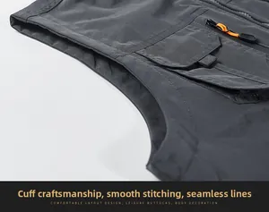Detail view of smooth stitching and water-resistant nylon fabric on dark gray outdoor vest
