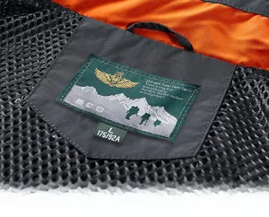 Detail of outdoor vest collar with breathable mesh lining and durable grey textured fabric