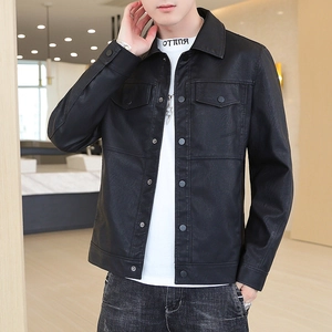 Close-up of a men's black faux leather biker jacket with lapel and snap pockets
