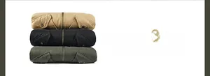 Close-up of stacked fleece-lined cargo jackets in khaki, black, and army green colors