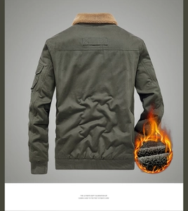 Detail of green work jacket featuring thick fleece lining and warm faux fur collar