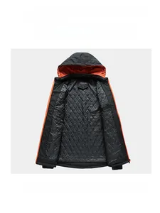Detail of men's jacket with black exterior and orange quilted lining for warmth