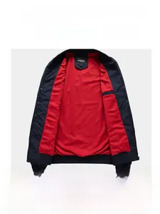 Detail of premium red mesh lining and brand label on a navy blue business jacket