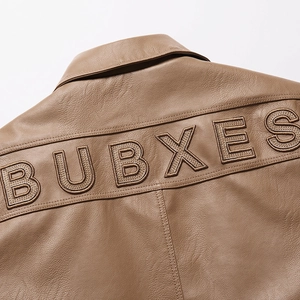 Detail of vintage brown leather jacket back with BUBXES letter embroidery and fine stitching
