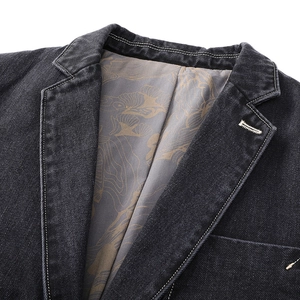 Men's black denim suit jacket featuring high-contrast stitching and vintage floral lining
