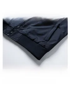Close-up of ribbed hem and durable metal zipper on men's navy blue casual jacket