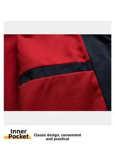 Detail view of red honeycomb mesh inner pocket and durable black fabric seams on men's jacket