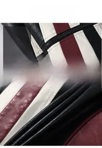Detail shot of the tricolor motorcycle jacket showing premium leather texture and stitching
