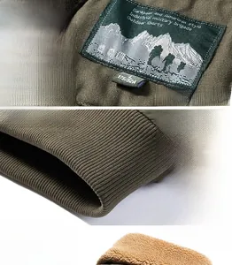 Close-up of military green jacket showing high-density ribbed hem and warm yellow fleece lining