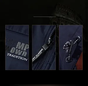 Detail of navy men jacket featuring precise embroidery, metal zipper and toggle drawstring