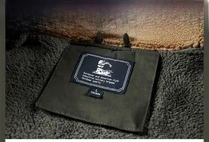 Detail of warm fleece lining and khaki sherpa collar on men's utility jacket