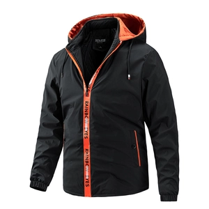 Men's hooded windbreaker jacket in black with orange contrast lining and zipper detail