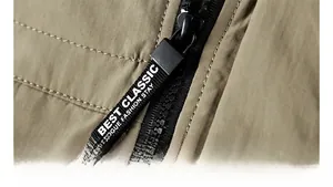 Detailed macro view of high-quality zipper and woven strap on khaki outdoor jacket