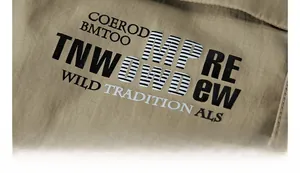 Close-up of military-style black letter printing on khaki outdoor tactical jacket fabric