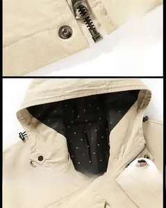 Macro detail of canvas jacket showing metal zipper and small fish pattern lining