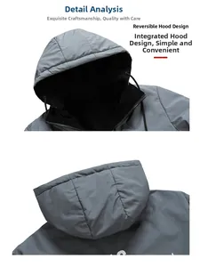 Détail de la veste à capuche réversible montrant l'extérieur gris et la doublure noire