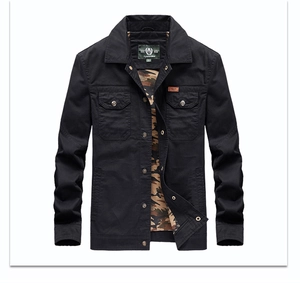 Close-up of black cotton utility jacket with camouflage lining and chest pockets