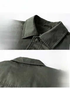 Detailed macro view of army green cotton jacket collar and shoulder with metal buttons