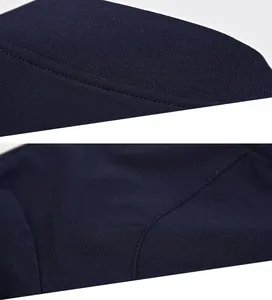 Detailed view of the stand collar and shoulder stitching on a dark navy casual jacket