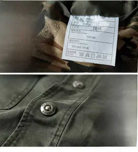 Detail of pure cotton military jacket showing the inner wash label and embossed alloy button