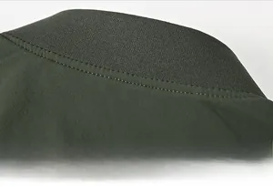 Detail of ribbed collar and high-quality stitching on dark olive outdoor jacket