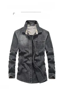 Detailed view of long-sleeve cotton denim shirt in dark grey with washed texture