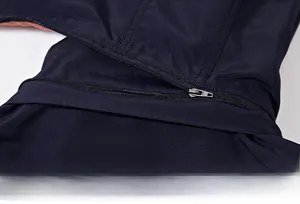 Detail view of the detachable hood design with metal zipper on dark blue men's jacket