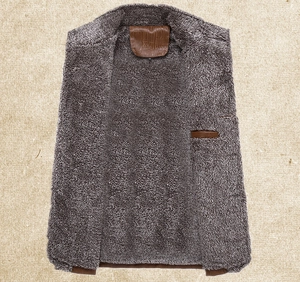 Close-up of brown leather jacket with thick faux fur lining and inner pocket detail