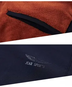 Detail of navy sports jacket showing warm brown sherpa lining and interior pocket design