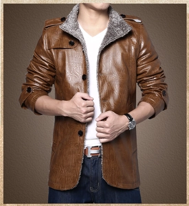 Close-up of brown faux leather jacket with crocodile texture and grey faux fur collar