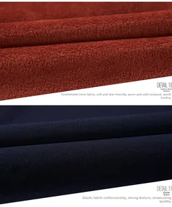 Detail view of men's jacket featuring warm reddish-brown fleece lining and elastic navy fabric