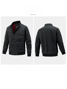 Close-up of black stand-collar jacket with ribbed cuffs and red lining detail